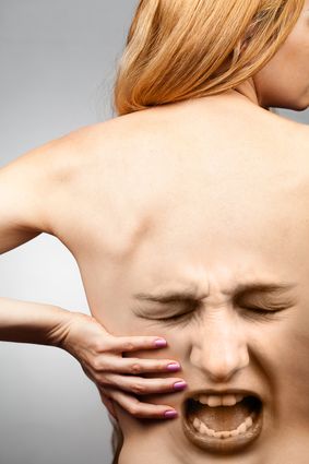 Screaming Back Pain Agonized face superimposed on woman's back to suggest back pain.